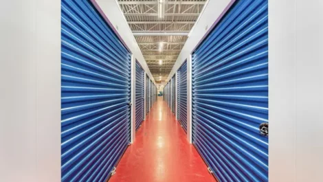 clean, well lit hallway showing indoor storage units