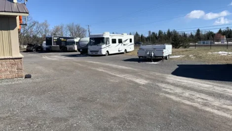 Uncovered RV and boat parking at self storage facility