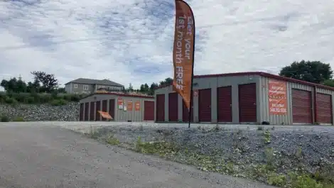 Driveway with signage up to self storage facility in Saint John