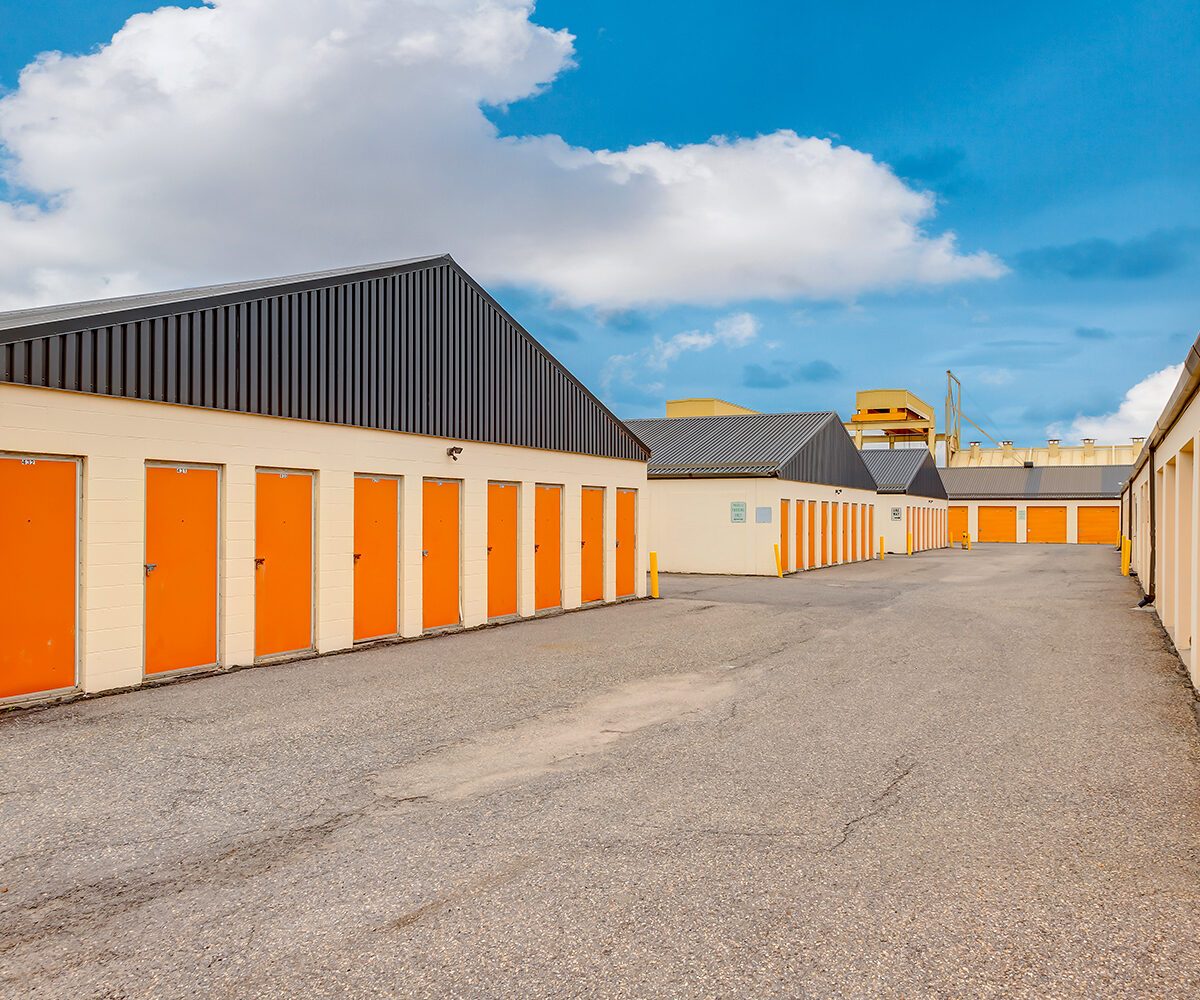 A Mini Mall Storage facility with doors painted in brand color, orange.