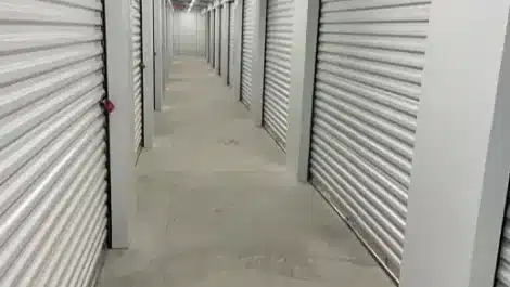 Clean, well lit hallway with storage units