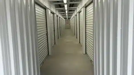 clean, well lit hallway leading to storage units