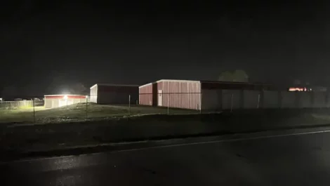 storage facility from road at night
