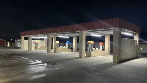 night photo of RV and car wash station at self storage location