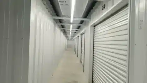 clean, well lit hallway of indoor storage units