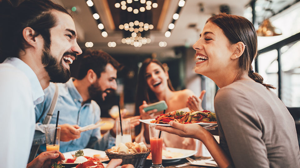 people eating and laughing together