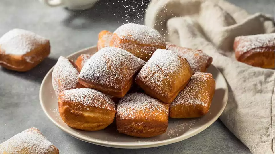 beignets covered in powdered sugar in New Orleans