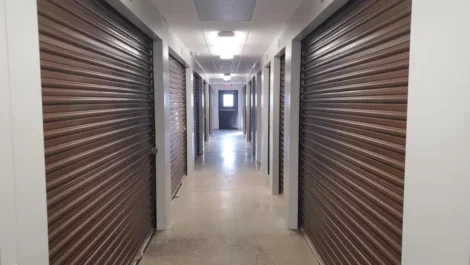 Clean , well lit self storage facility hallway