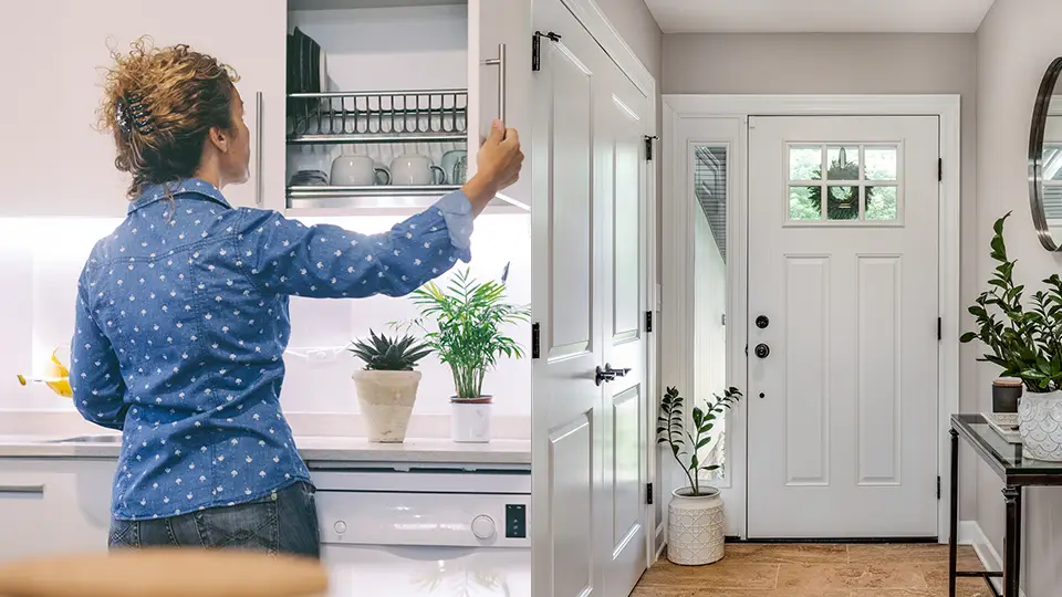 A woman putting away dishes