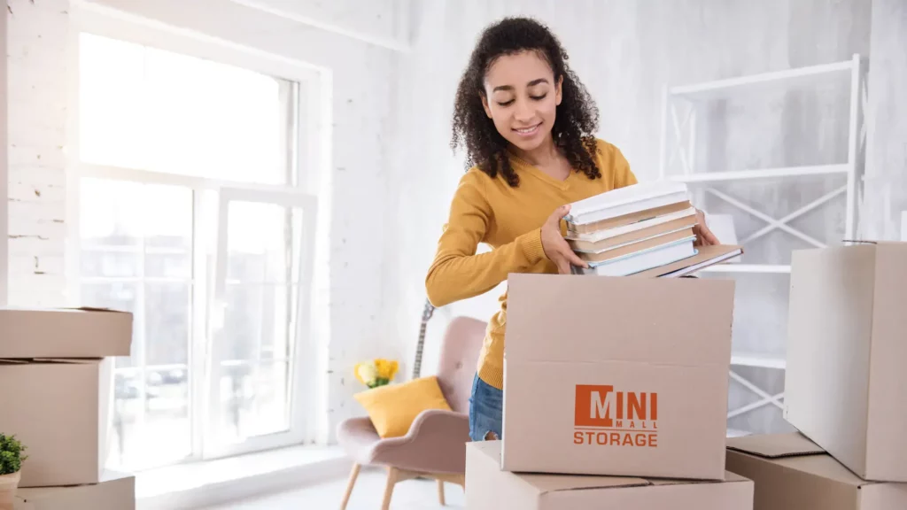 A student packing boxes from Mini Mall Storage to head off to university