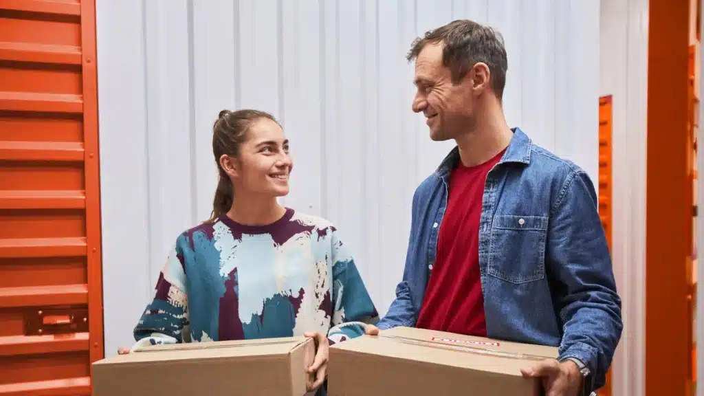 A father and daughter putting belongings in storage at Mini Mall Storage