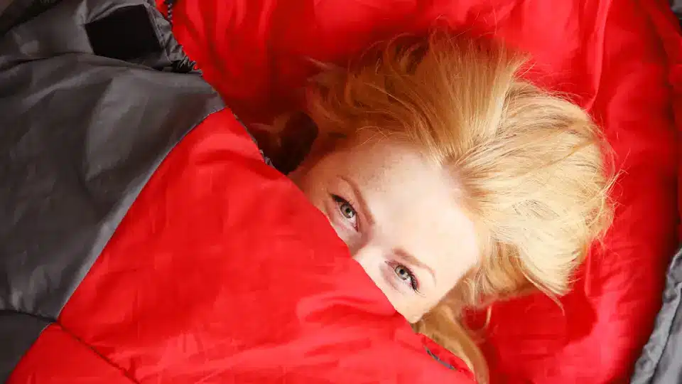 A woman in a sleeping bag
