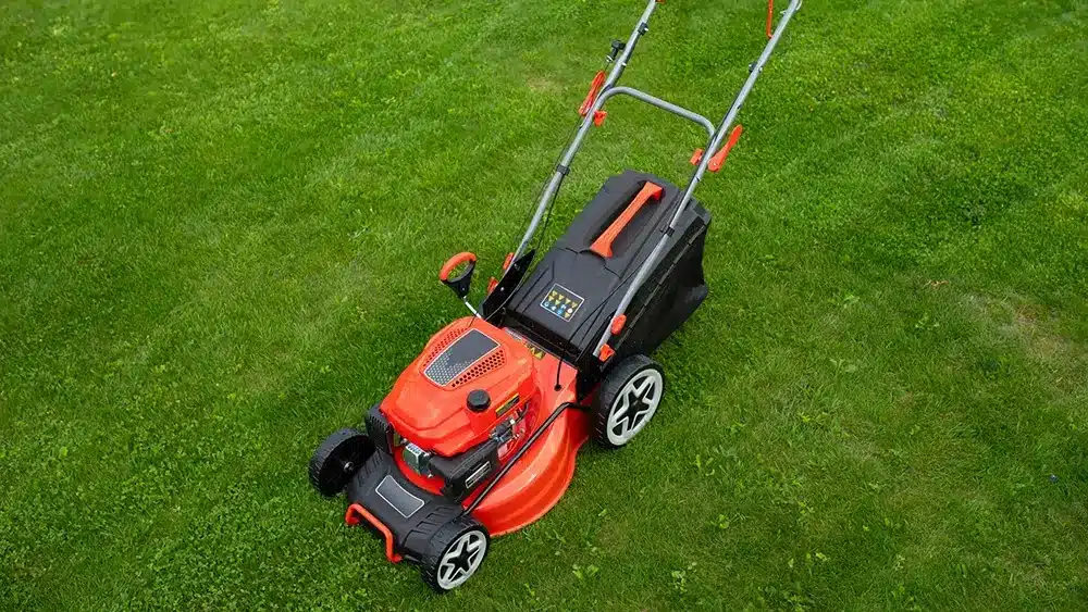 A photo of a lawn mower on grass