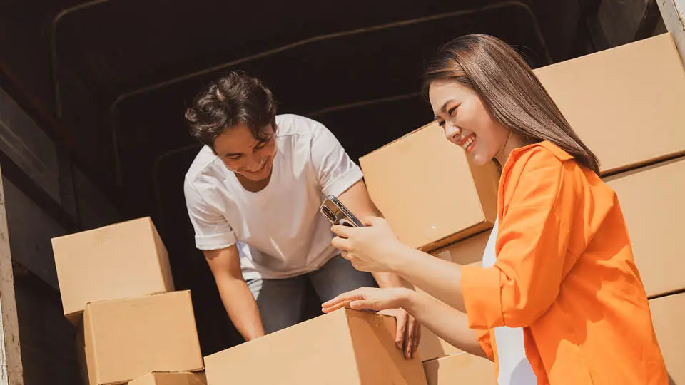 A family moving in their boxes at Mini Mall Storage