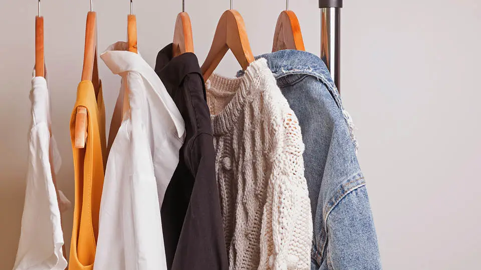 Clothing hanging on a rack for a capsule wardrobe 