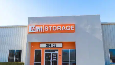 Sunny view of Mini Mall Storage siganage on front office